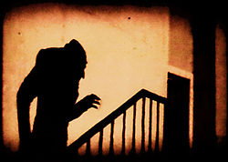 shadow of vampire creeping up the stairs